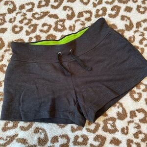 Athletic shorts. Gray with lime interior waistband. Size small. Size small.